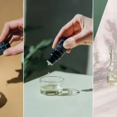 Droppar av parfym olja från små flaskor ner i skålar. En flaska med rosmarin och en med kamomill syns också.