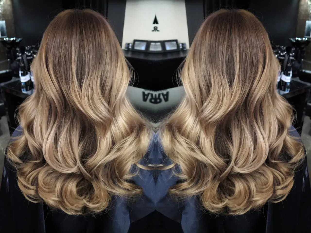 Vackert balayage ljust hår med mjuka vågor. En perfekt solkysst look.